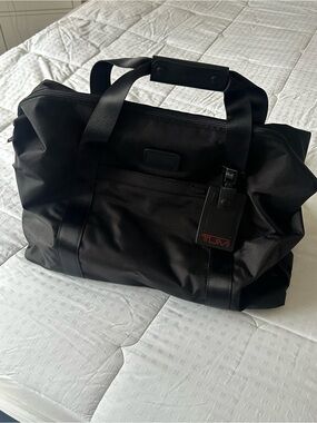 Tumi Black Nylon Weekend Duffel with Front Pocket, Trolley Sleeve & Luggage Tag